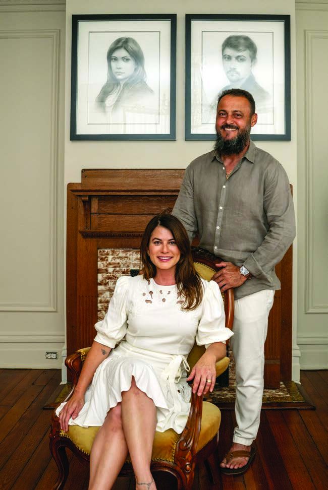 Michelle and Ronny Camilo in the parlor of their home